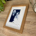Portrait Robin Shape Picture Light brown wood-grain Frame on the table