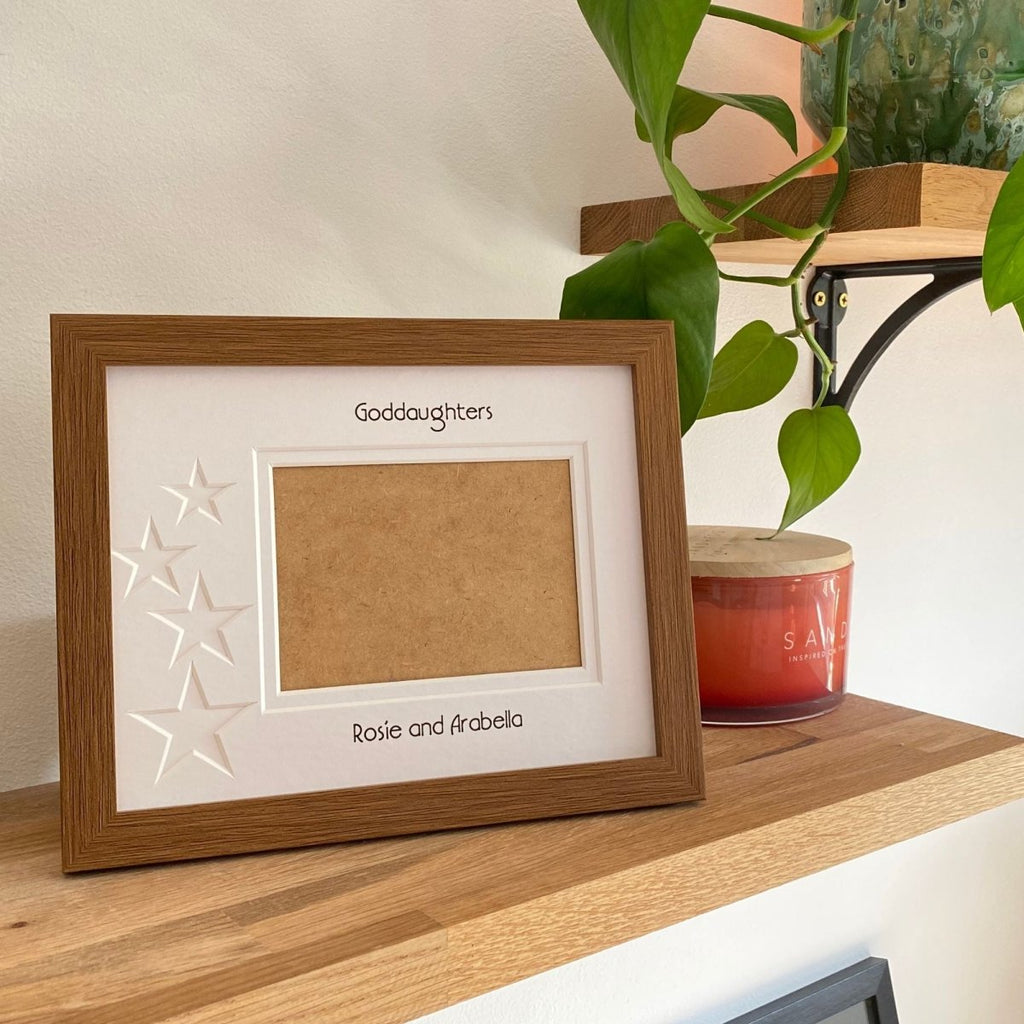Brown 1-aperture picture frame displaying a family photo on wooden shelf