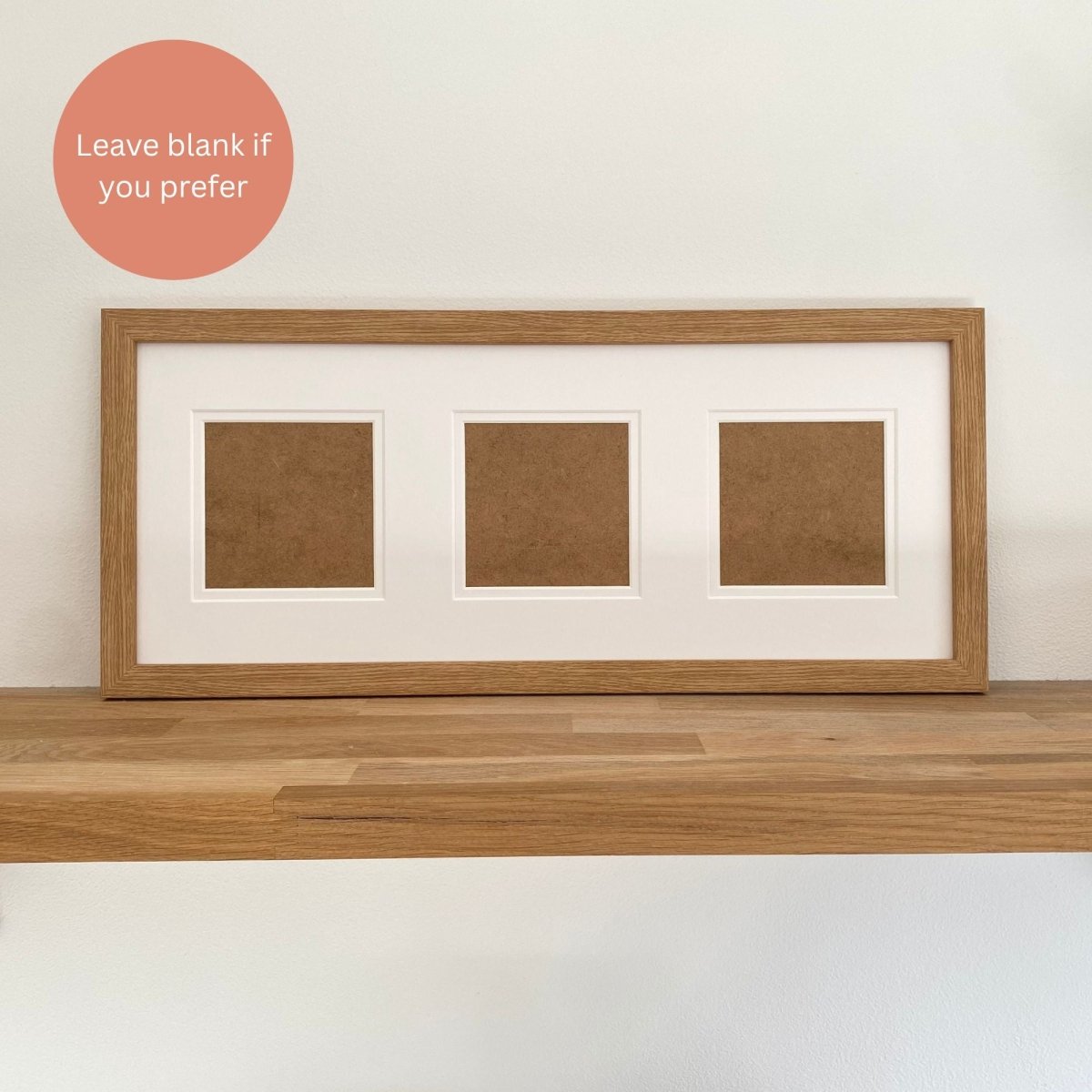 wood-grain frame with white multi-aperture mount on wooden shelf