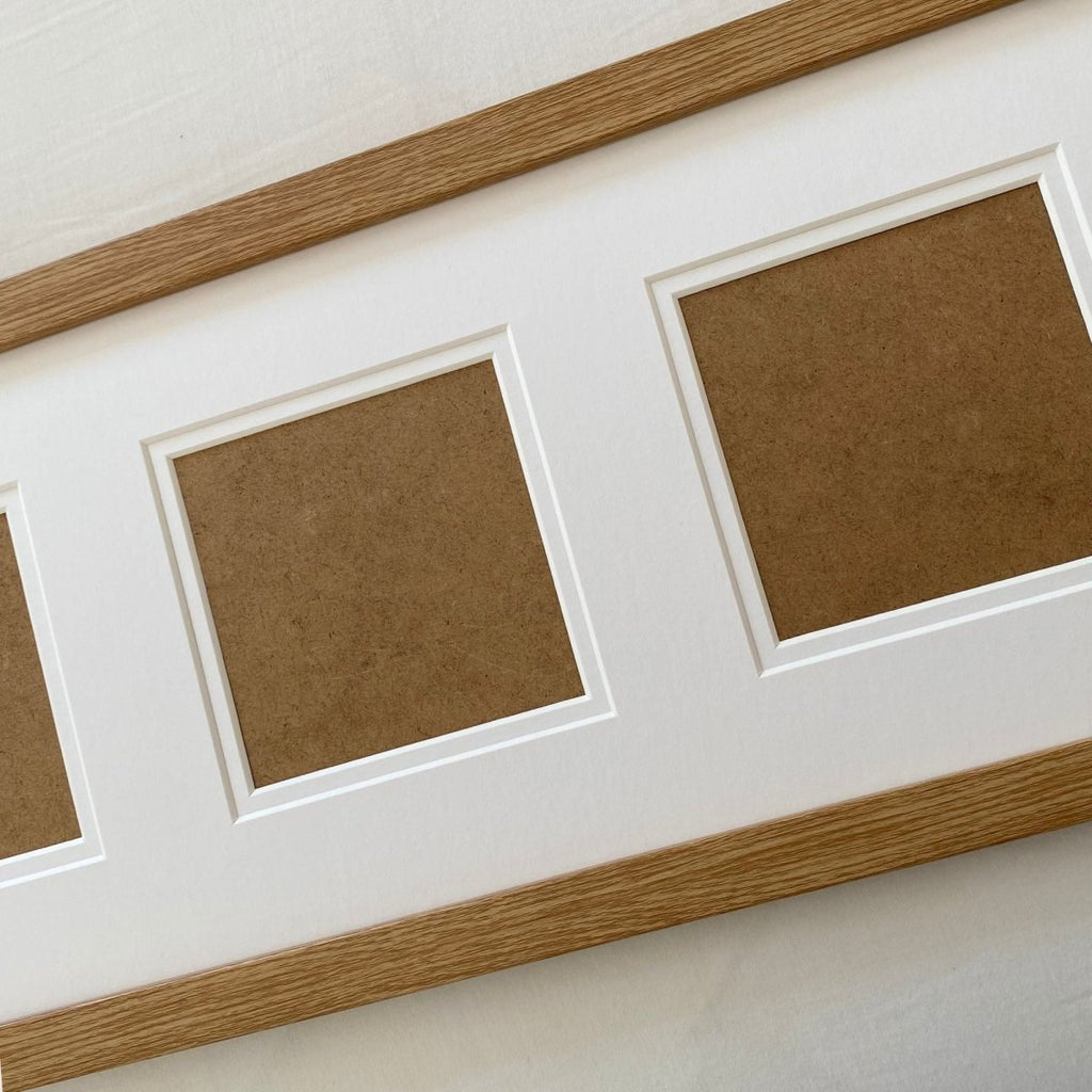 Close-up of a wood-grain effect picture frame, clean cut openings for photo display - Azana