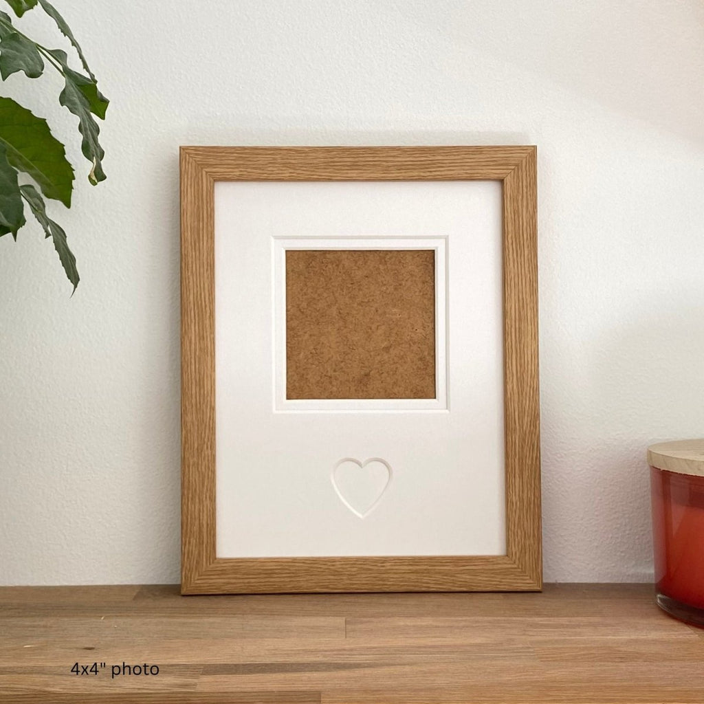 Light brown blank 1-aperture heart picture frame showing empty photo opening.