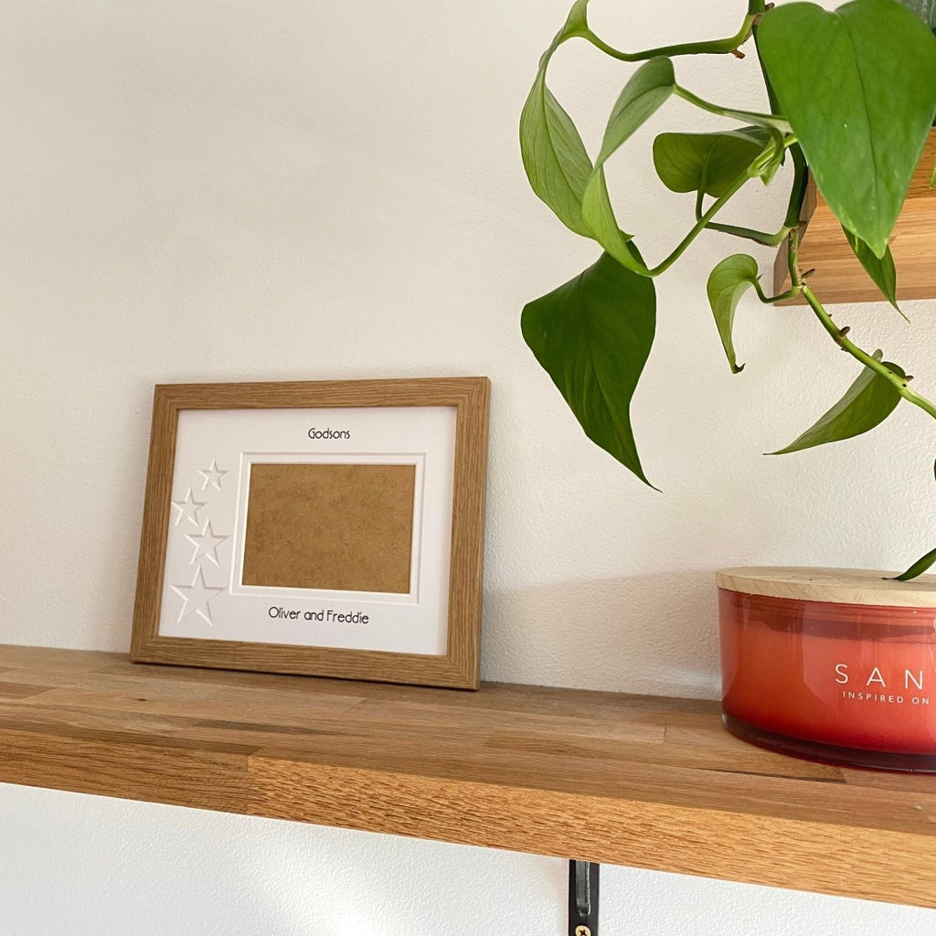 One aperture light brown picture frame lifestyle shot with home decor