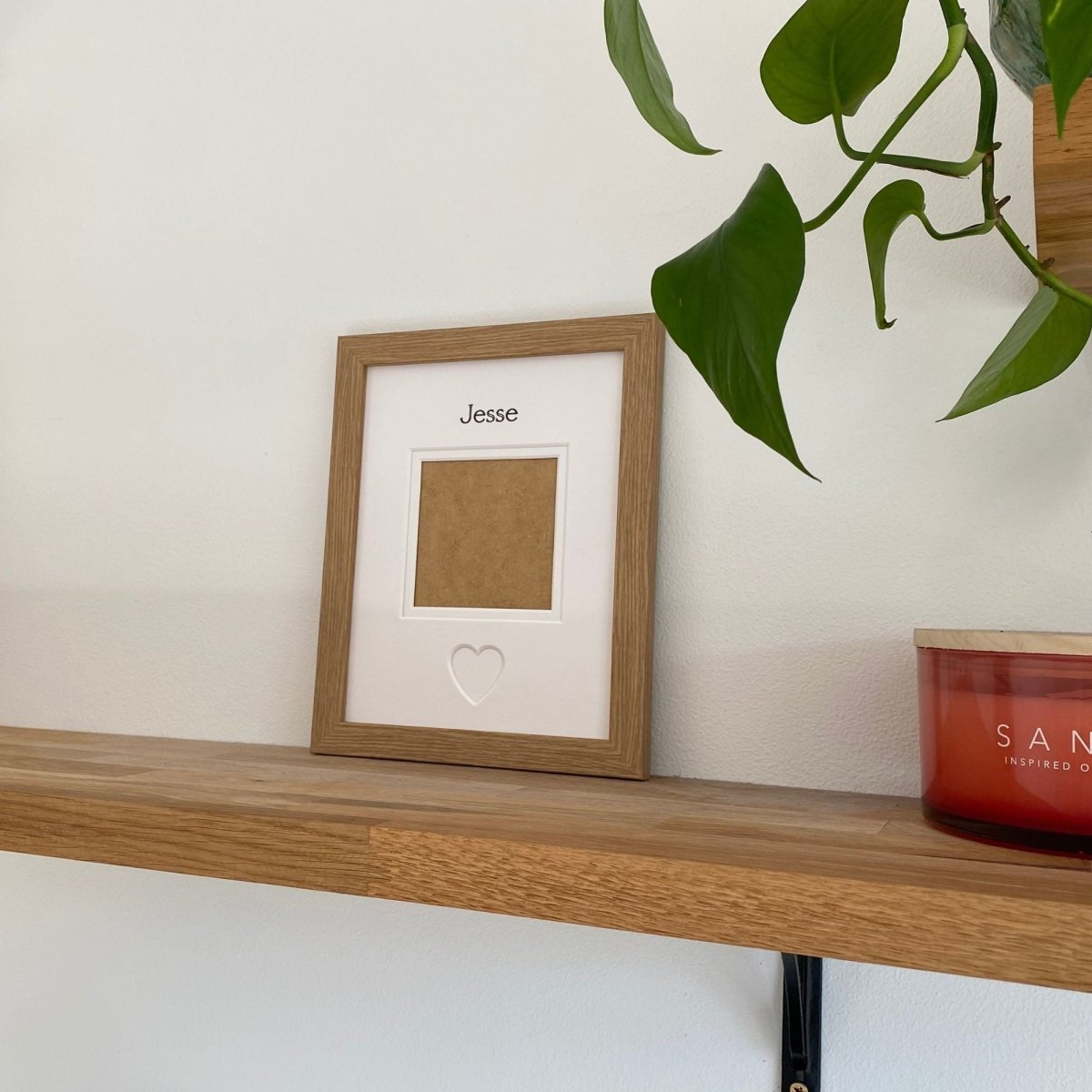 Light brown single aperture picture frame showing an empty photo opening