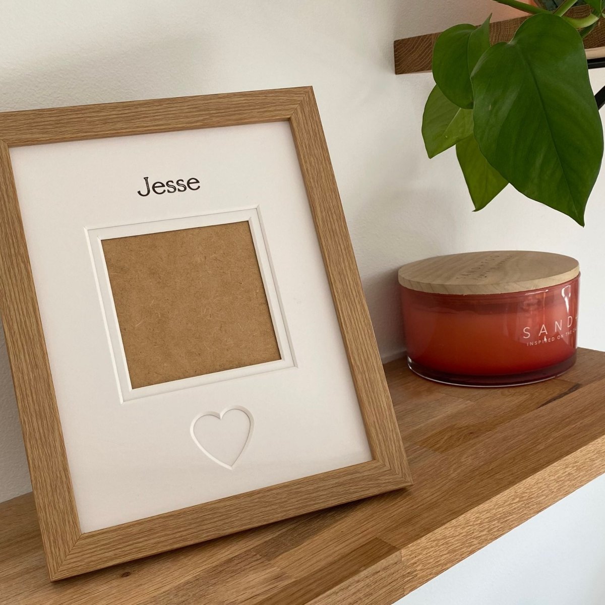 Light brown single aperture picture frame showing a heart shaped and empty photo opening
