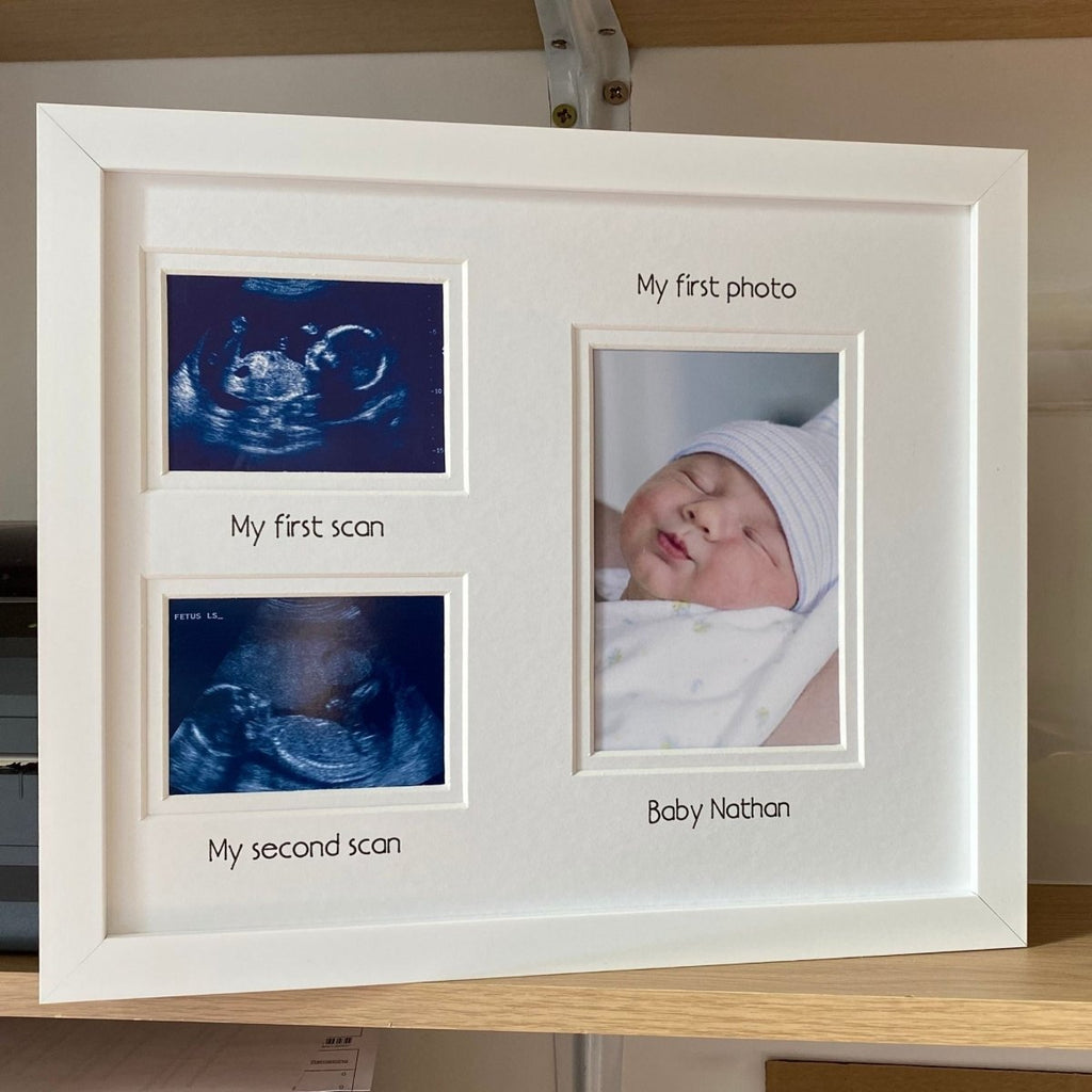 White photo frame with ultrasound images and a baby photo