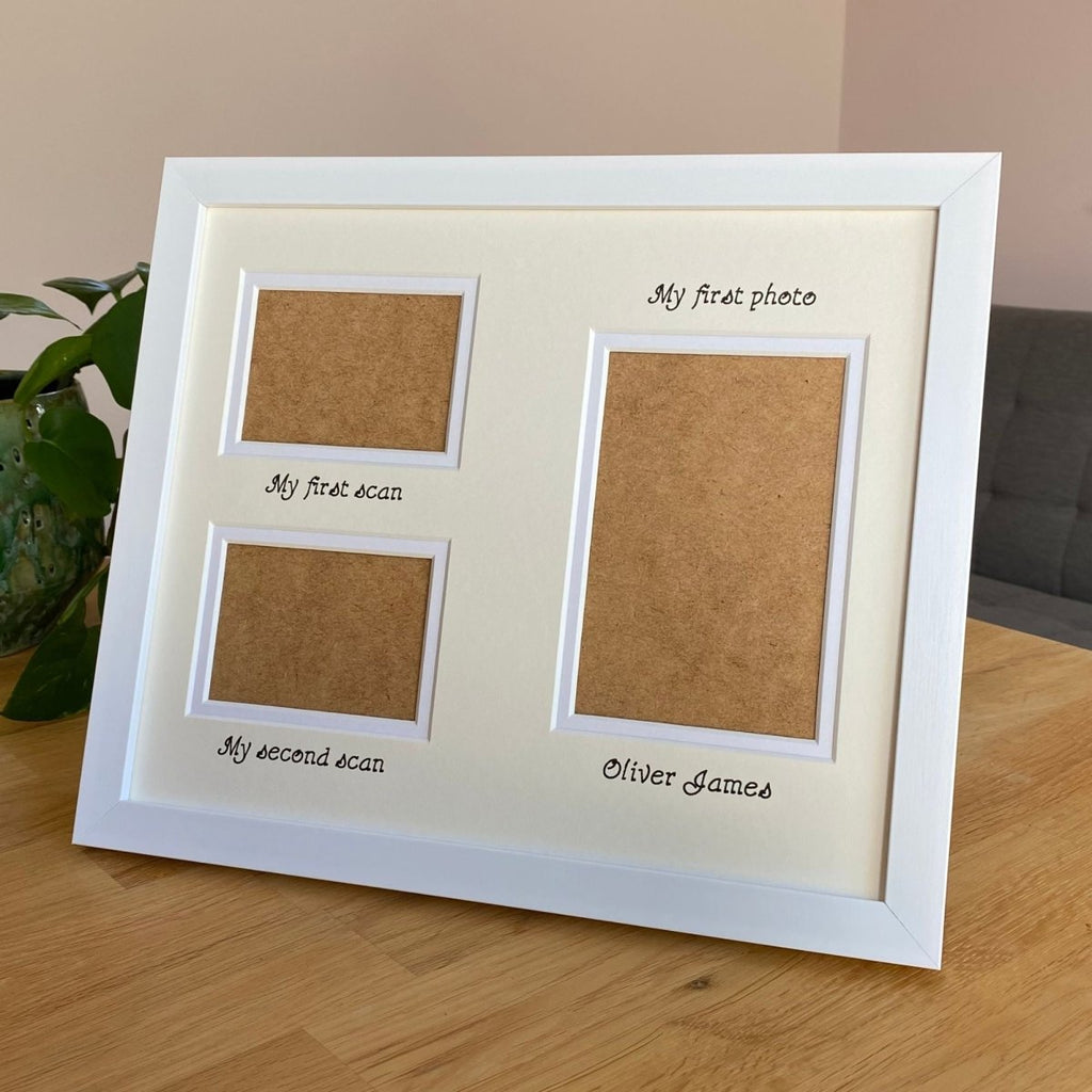 Framed display with three apertures and text on a wooden table 