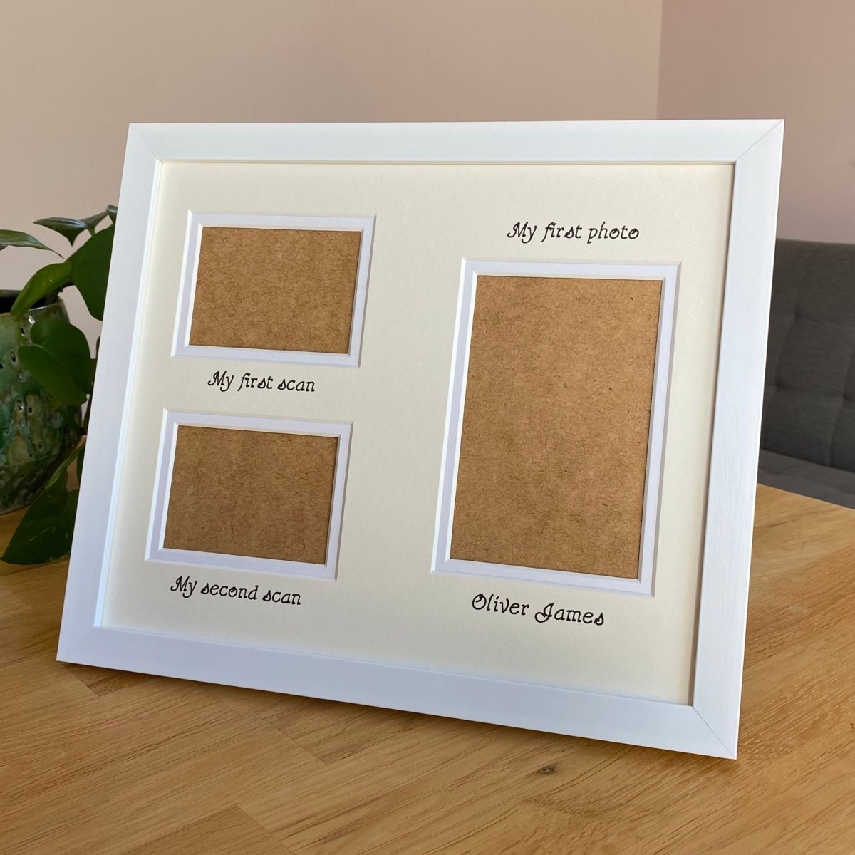 Framed display with three apertures and text on a wooden table 