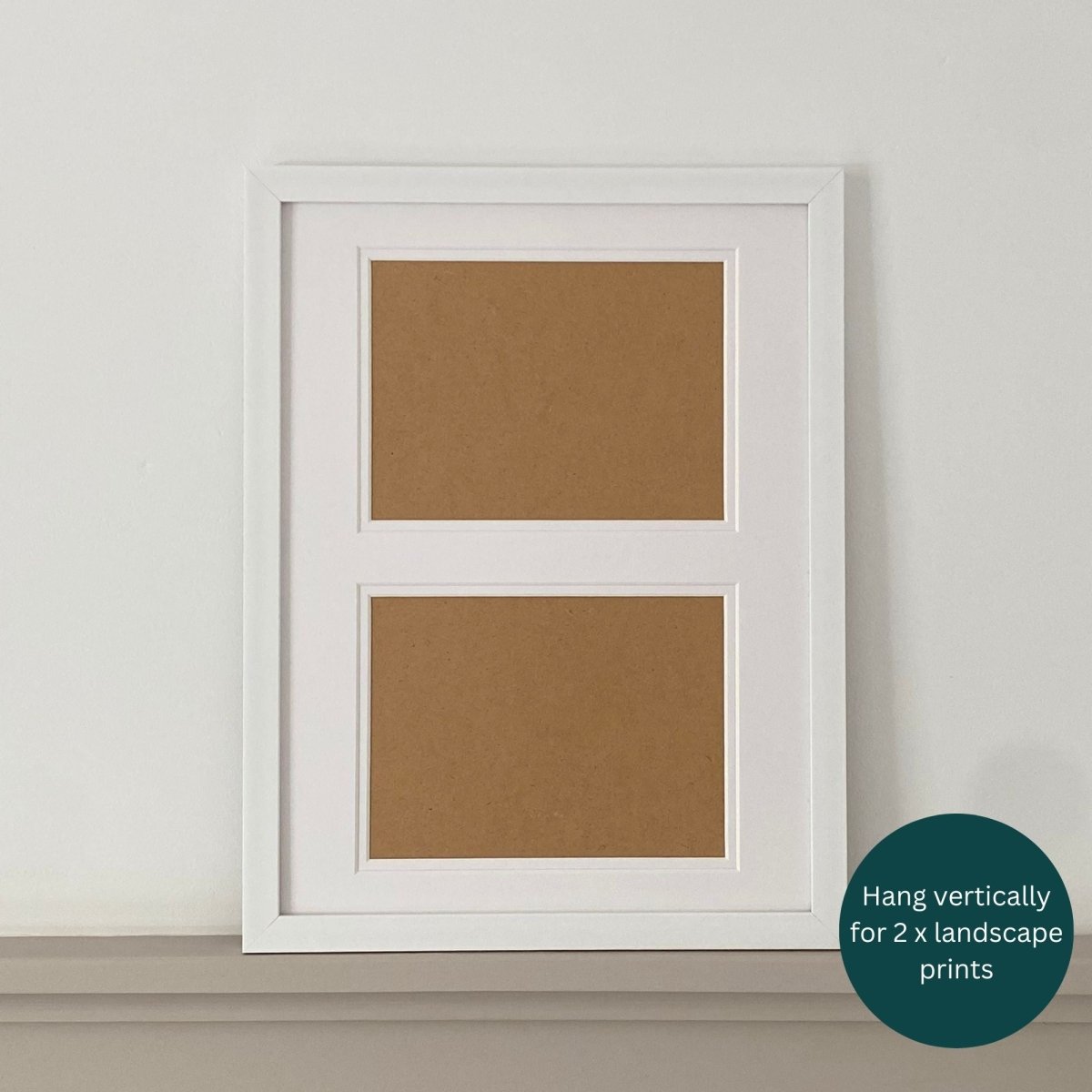 White frame against the white wall on grey shelf