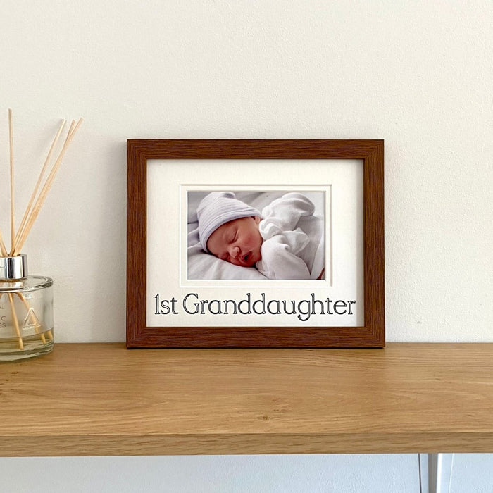 1st Granddaughter Picture Frame, Dark Brown on the shelf in landscape