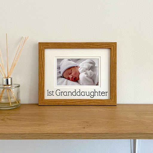 Light brown 1st Granddaughter Picture frame on the shelf