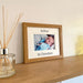 Showcases a photograph of a baby Grandson in a Picture Frame on the shelf next to a diffuser