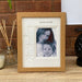 Portrait frame, a photo of an Auntie and young boy nephew on a tabletop next to a diffuser
