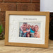 Auntie, Uncle and Us Picture frame on the tabletop next to a white lamp