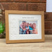 Auntie, Uncle and Us in light brown picture frame on the tabletop