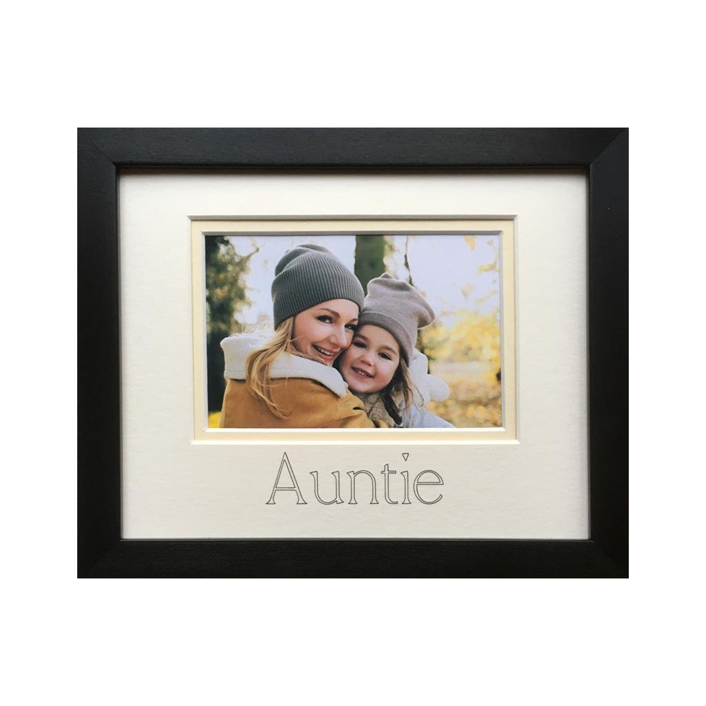 Photograph of an Auntie and a girl in a black photo frame