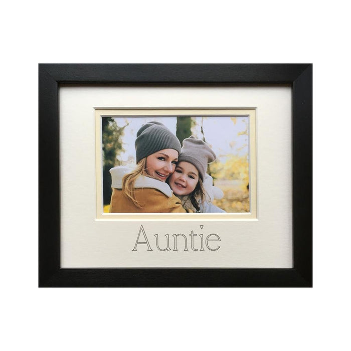 Photograph of an Auntie and a girl in a black photo frame