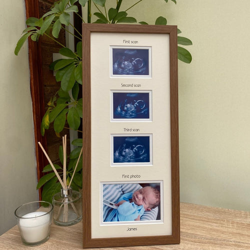 Multi-picture frame in dark brown standing against the green plant on the shelf