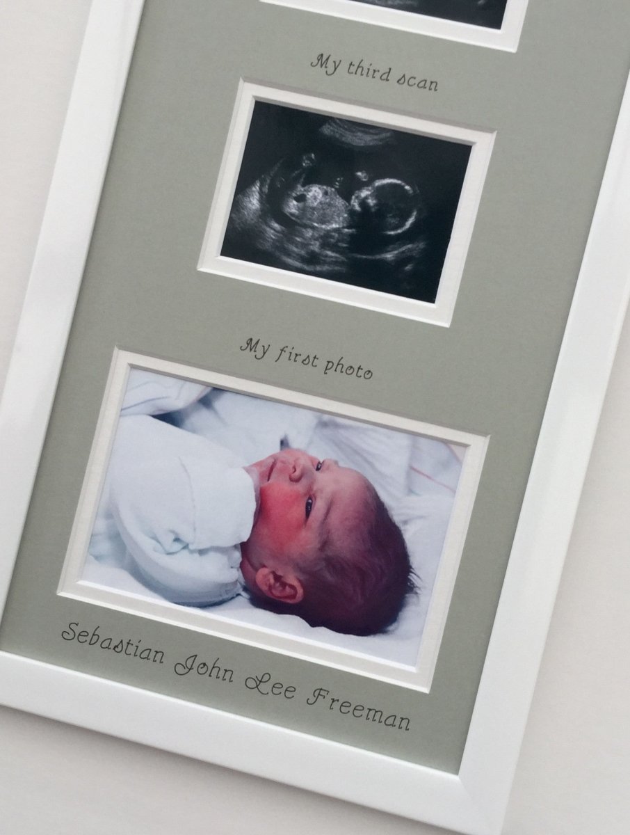 White frame with a grey picture mount showing the custom personalisation