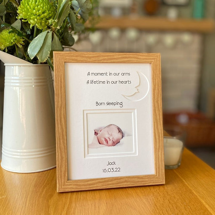 Baby Loss Born sleeping Picture frame on table nect to a jug of flowers and a candle