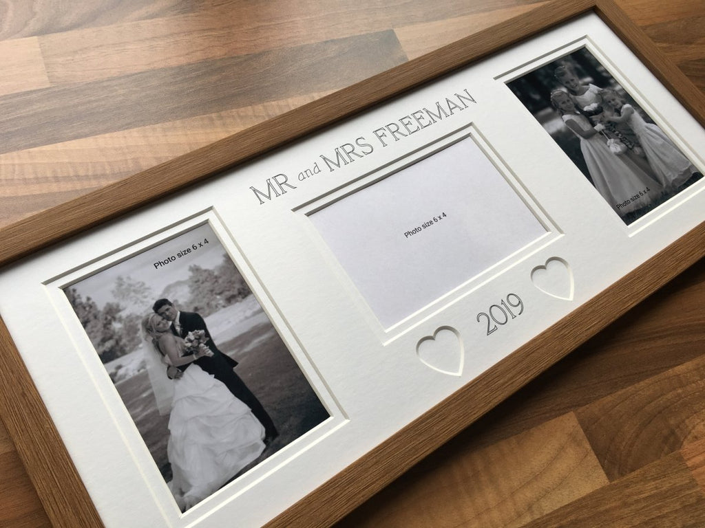Heart-shaped mount, wedding picture frame on brown table