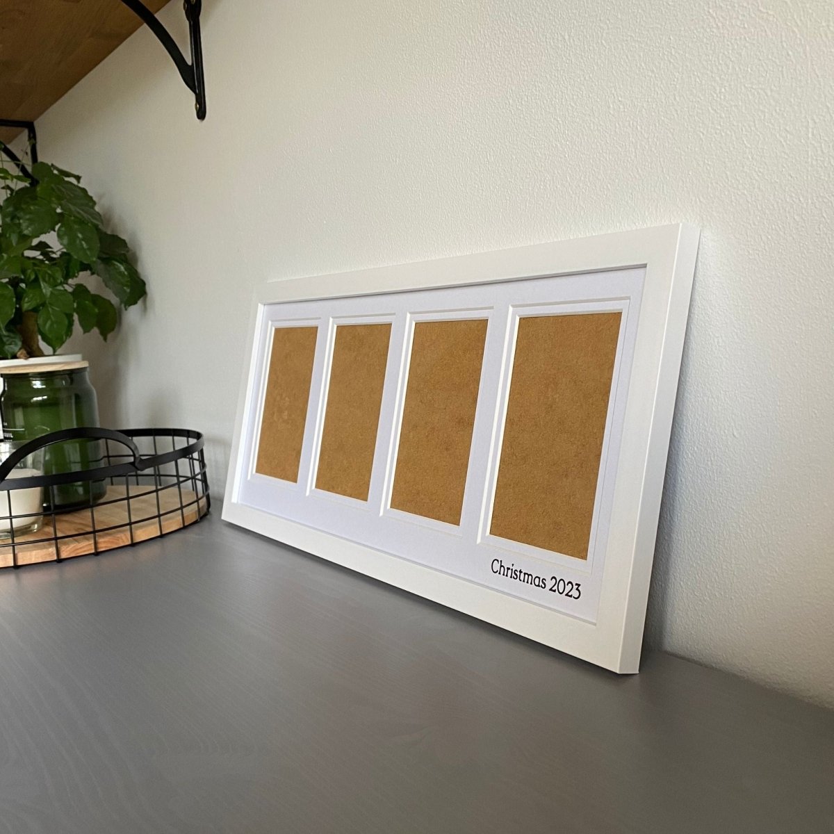 White Multipicture Frame 4 Photos, on grey dresser next to mesh tra, candles and green planty - Azana Photo Frames