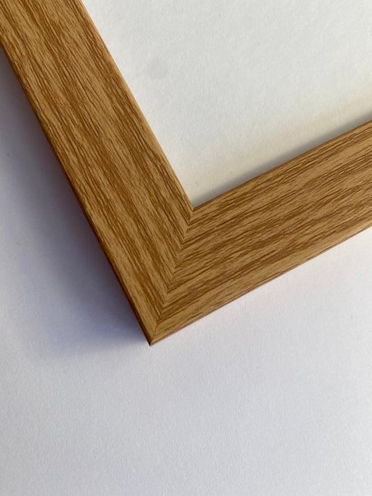 Light brown, wood-grain effect polcore moulded frame