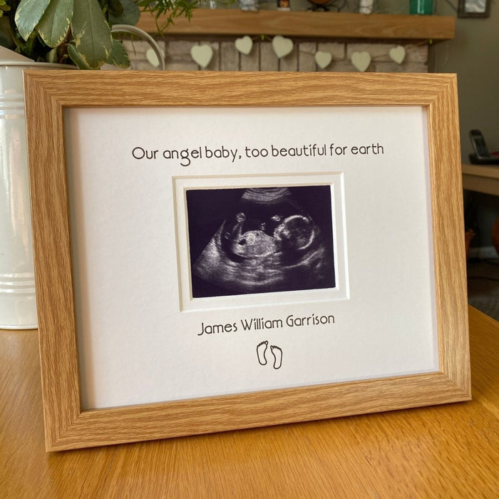 Light brown wood-grain effect contemporary frame, angel baby too beautiful for earth. Displaying a scanned sonogram image of the baby during miscarriage