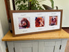 Wall Collage Multipicture Pet Dog Frame, rests on the tabletop of the cabinet