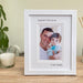 White Portrait Picture Frame of a Girls 1st love is her Daddy, resting on the tabletop surrounded by a white candle and diffuser