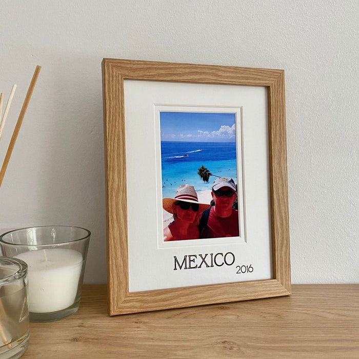 Mexico picture frame on a shelf next to a candle