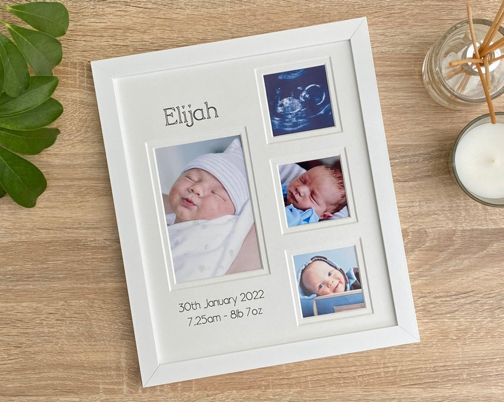 Baby Collage dark brown picture frame, laying down on the tabletop next to a white candle, diffuser and green plant