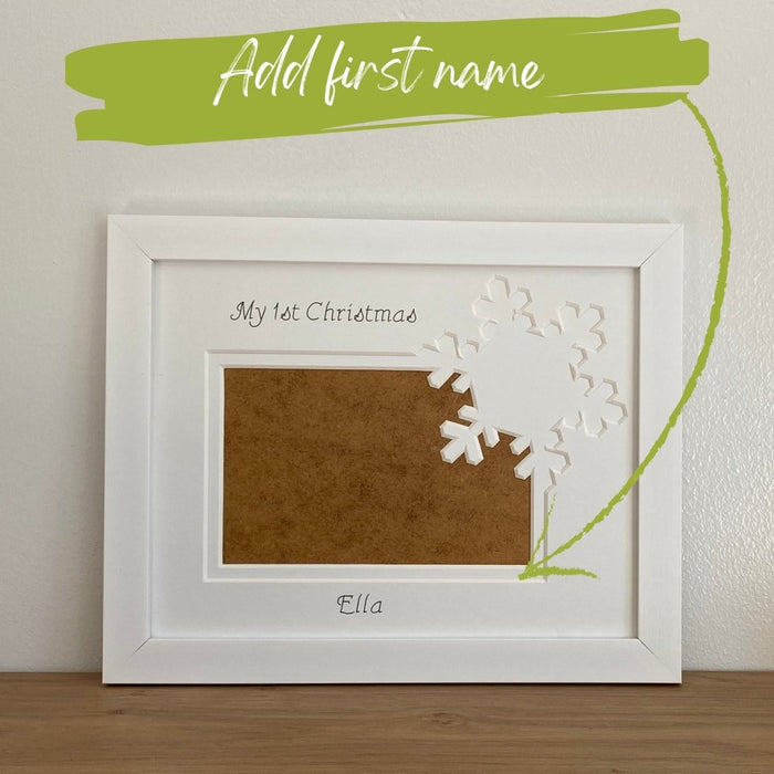 Add first name to be inscribed on the white Christmas snowflake picture frame