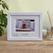 A fox red labrador puppy in the white contemporary frame. And home decor of a white candle and diffuser and plant