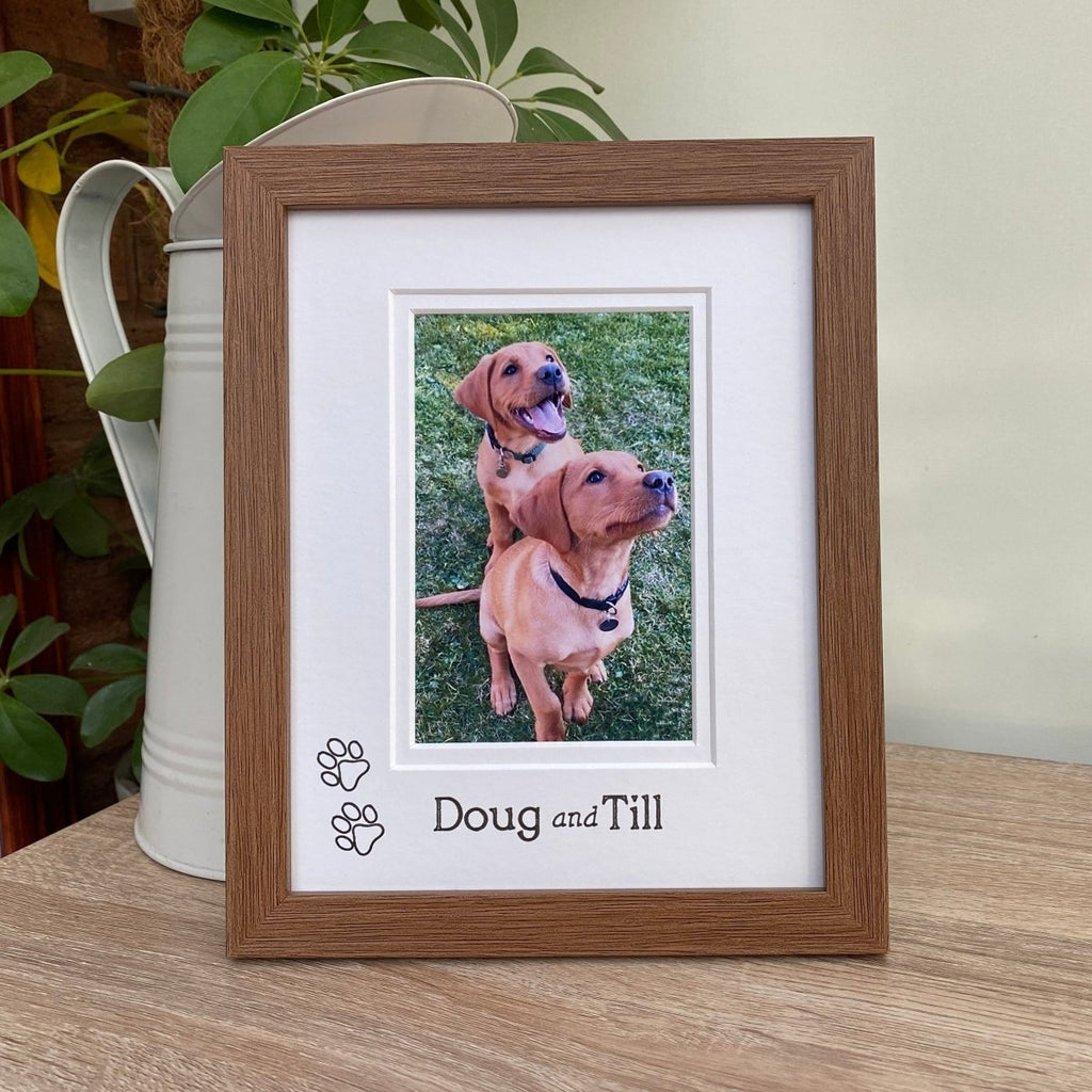 Dark brown picture frame, freestanding on the tabletop with a jug. Insert photo of any breeds, dogs or a pup