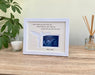 White frame with a cream double matted displaying a baby sonogram image for pregnancy loss gift, next to a white candle to light up on baby's remembrance anniversary..