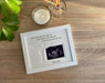 White picture frame for pregnancy miscarriage loss with the baby's surname inscribed, i.e. Baby Jones. 
