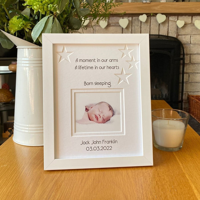 Baby born sleeping white contemporary picture frame with the star shapes, double white matted.