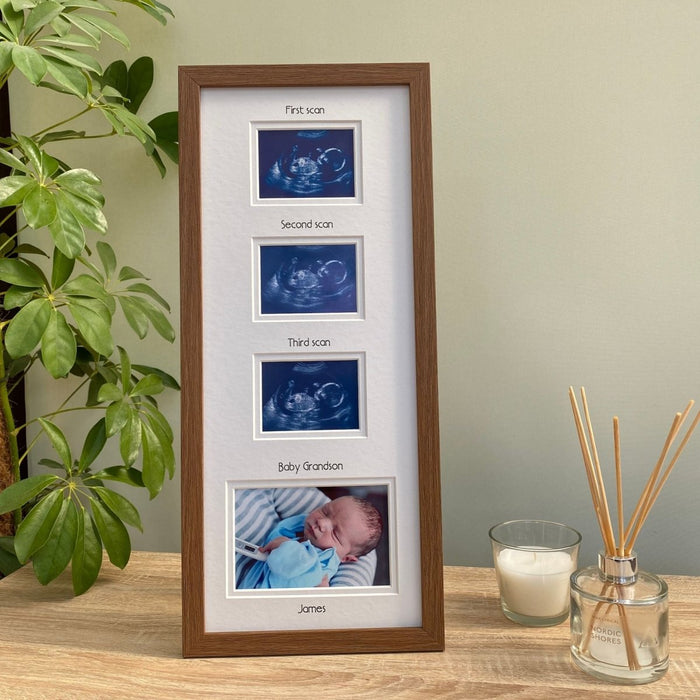 Dark brown, triple scan picture frame for boy on tabletop next to candle, diffuser and plant
