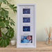 White triple baby scan picture frame standing on tabletop next to a white candle, diffuser and a plant. Frame is displaying the sonogram scans and first photo of the baby.