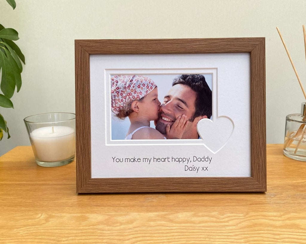 Wood-effect dark brown frame on the table top with the love heart shaped picture mount, a message for Daddy on Valentines Day